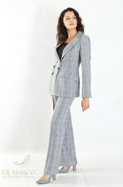 Gray women's suit in a check pattern with a fashionable houndstooth pattern. Polish manufacturer of luxury business formal clothing for women De Marco